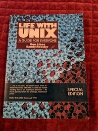 Life with UNIX book cover. Mostly covered with an irregular blue geometric pattern