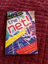 Cover of the You Can Surf the net! book. Features a square-shaped tunnel where the walls are made out of multicolored circuitboards and crackling electricity.